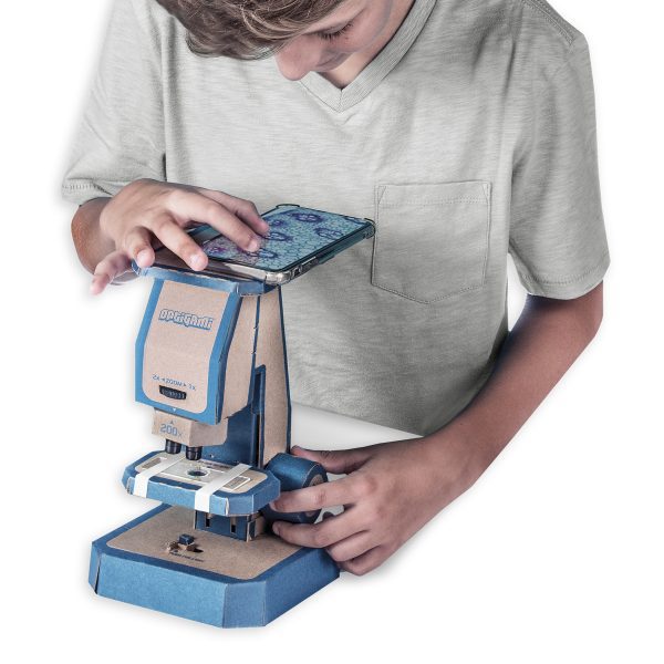 Child using cardboard microscope