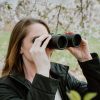 Birding Camper using Carson binoculars for bird watching outdoors for high definition images