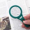 Senior using DX-50 Carson MagnetMag Magnifier Magnifying Glass with Magnet Handle as a Reading Aid for comfortable convenient reading