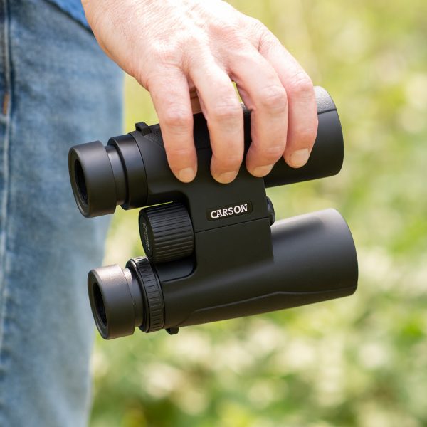 hunter using Carson Makalu Travel Binoculars for hiking outdoors, MK-042 Carson Binoculars full size high power binoculars 10x42